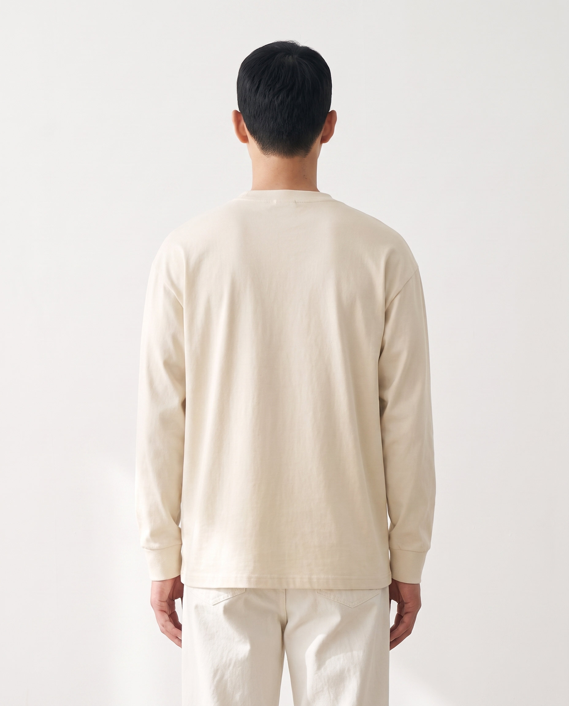 The Heavy Long Sleeve in milk apricot, back view