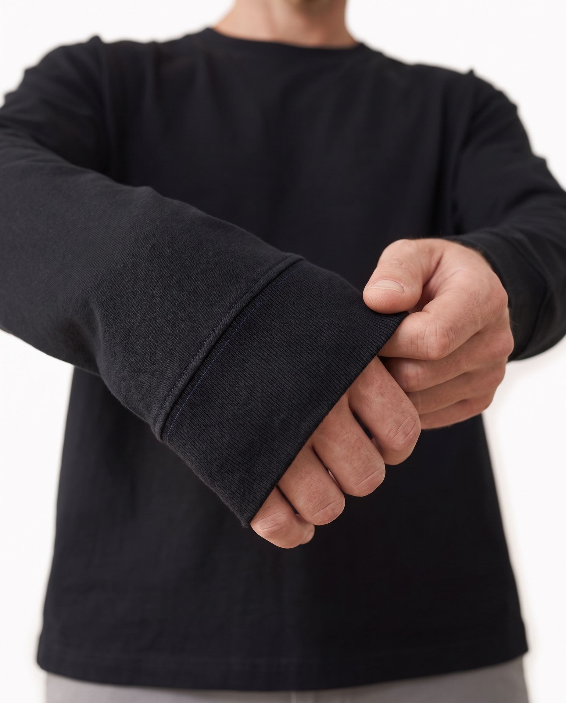 The Heavy Long Sleeve, navy signature stitch on the ribbed cuff, black