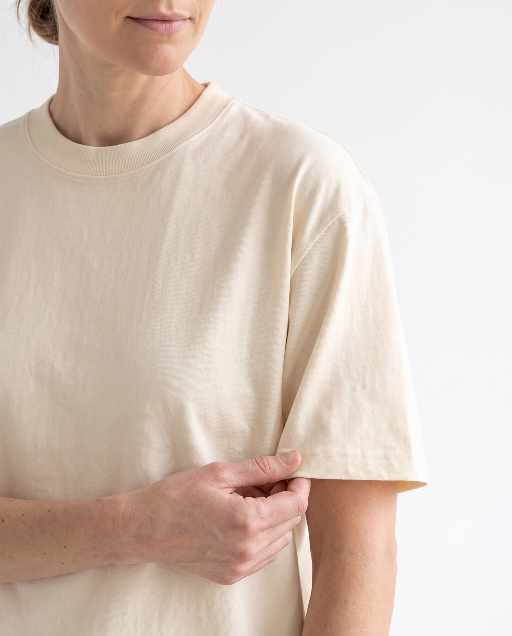 The Everyday Tee in apricot, shoulder seam and fabric detail
