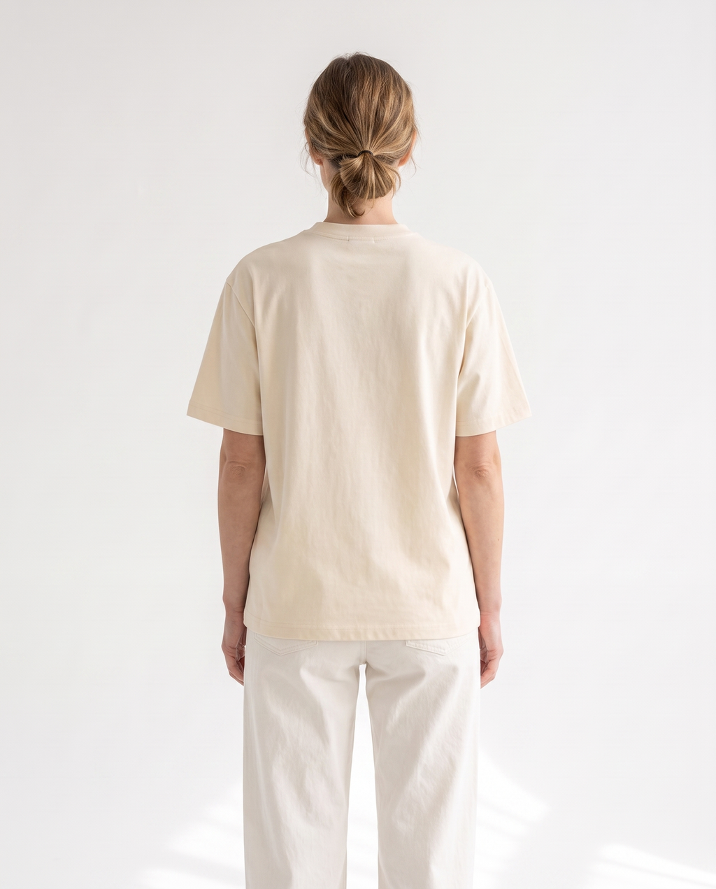 The Everyday Tee in apricot, back view