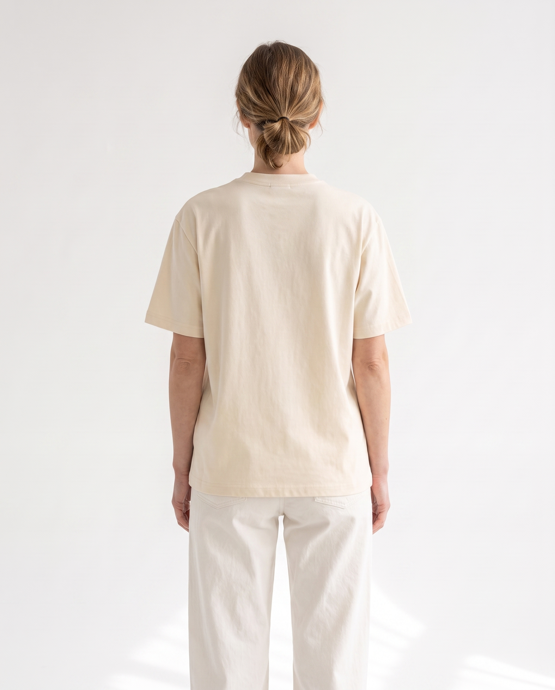 The Everyday Tee in apricot, back view