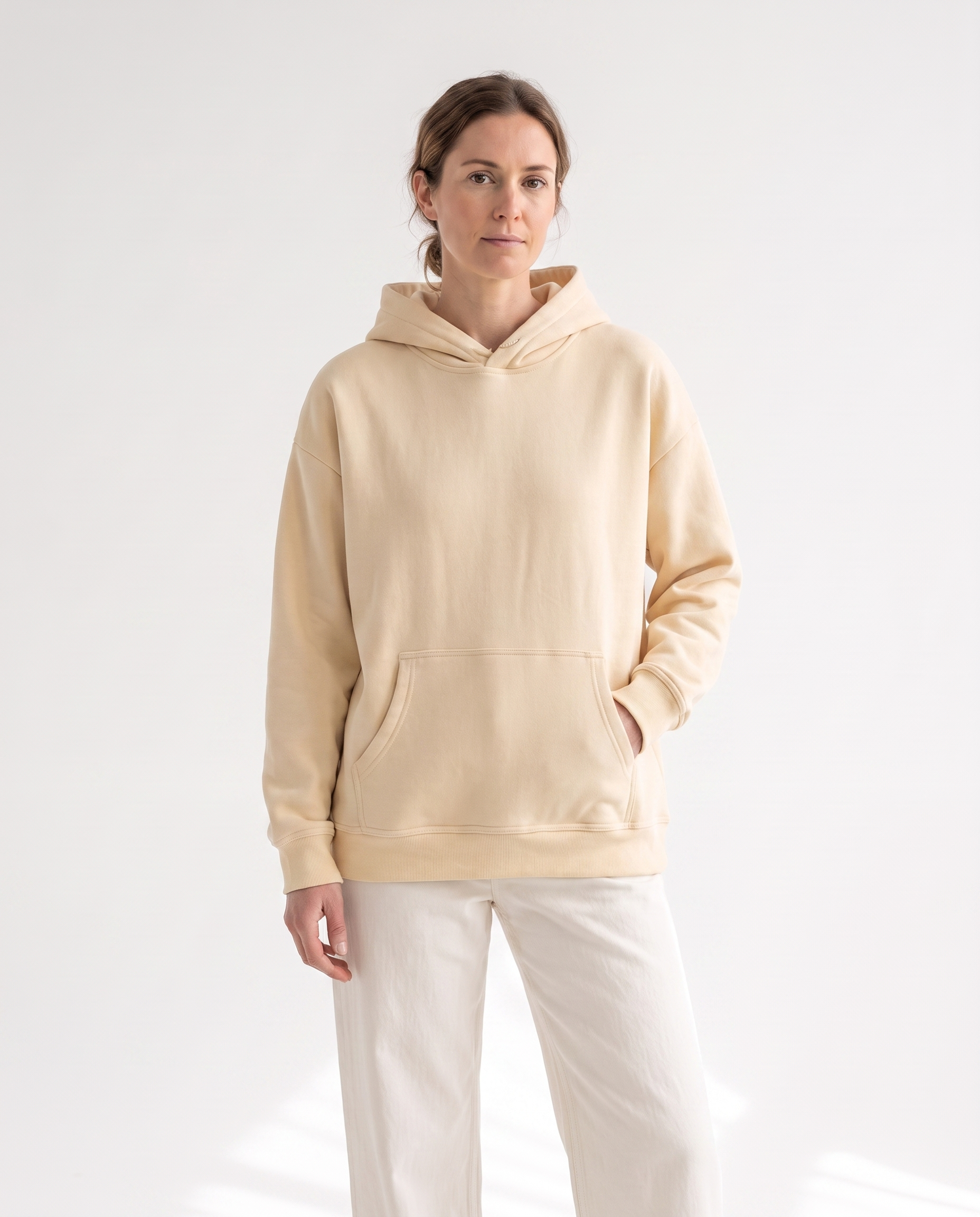 color::Apricot|The Heavy Hoodie in apricot, front, on model