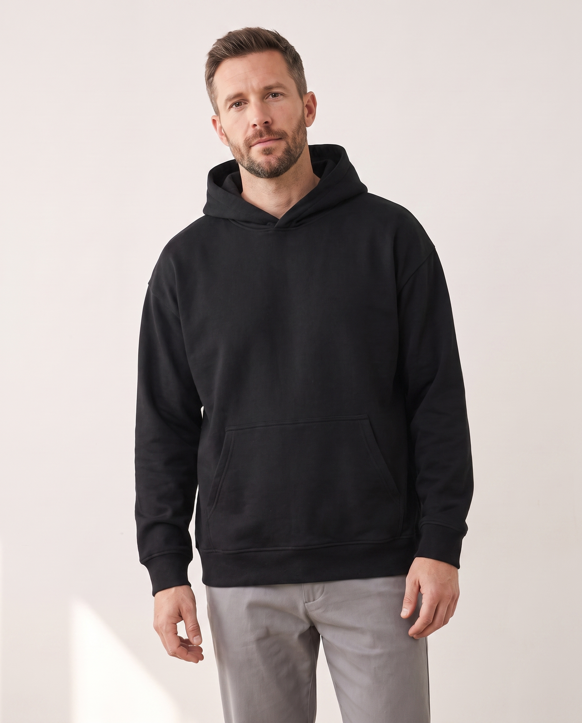 color::Black|The Heavy Hoodie in black, front, on model