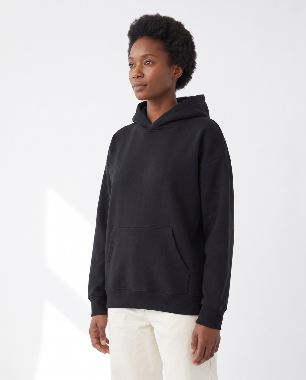 The Heavy Hoodie in black, side view