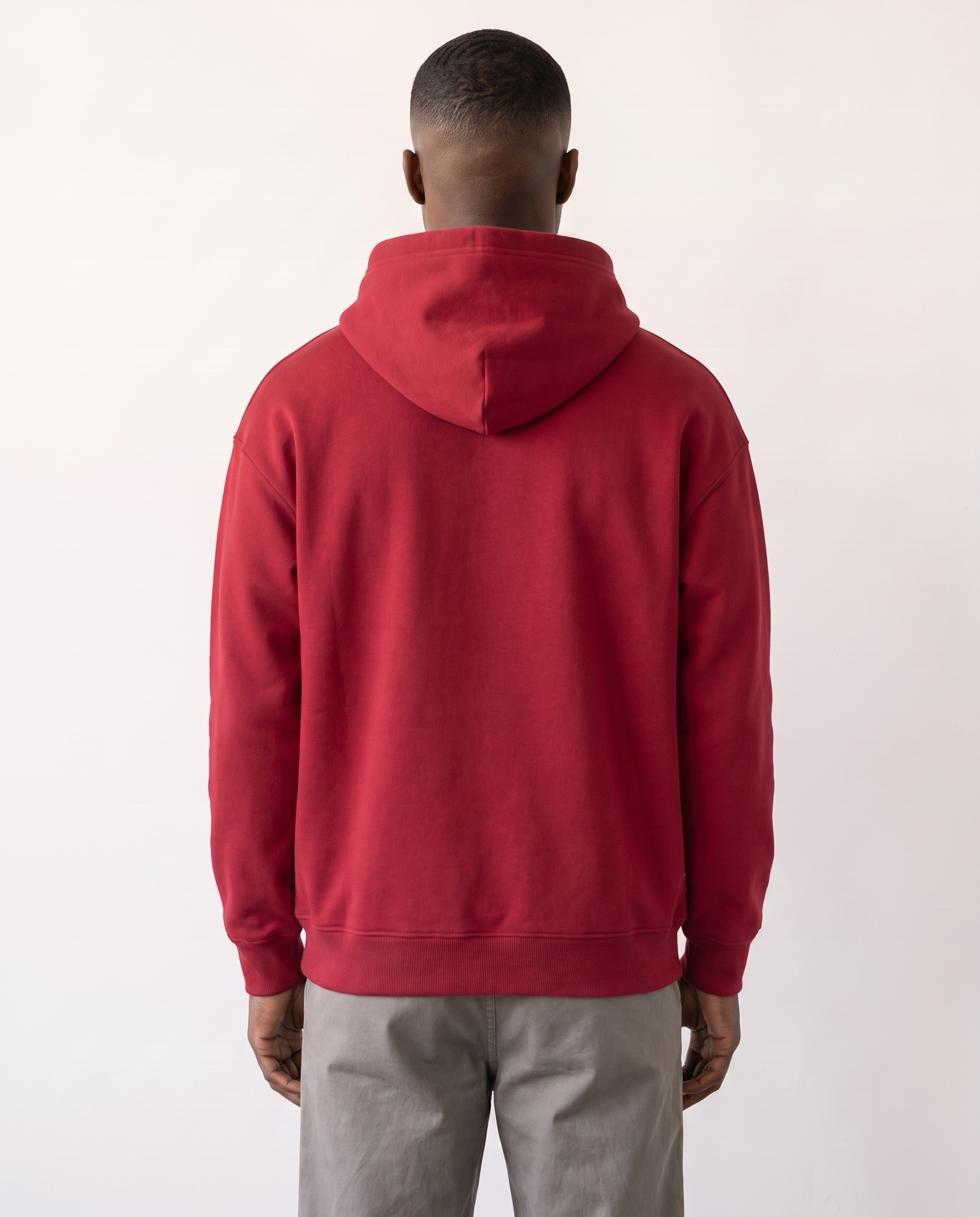 The Heavy Hoodie in red, back view showing the hood