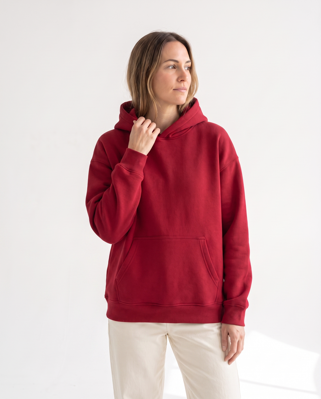 The Heavy Hoodie in red, side view