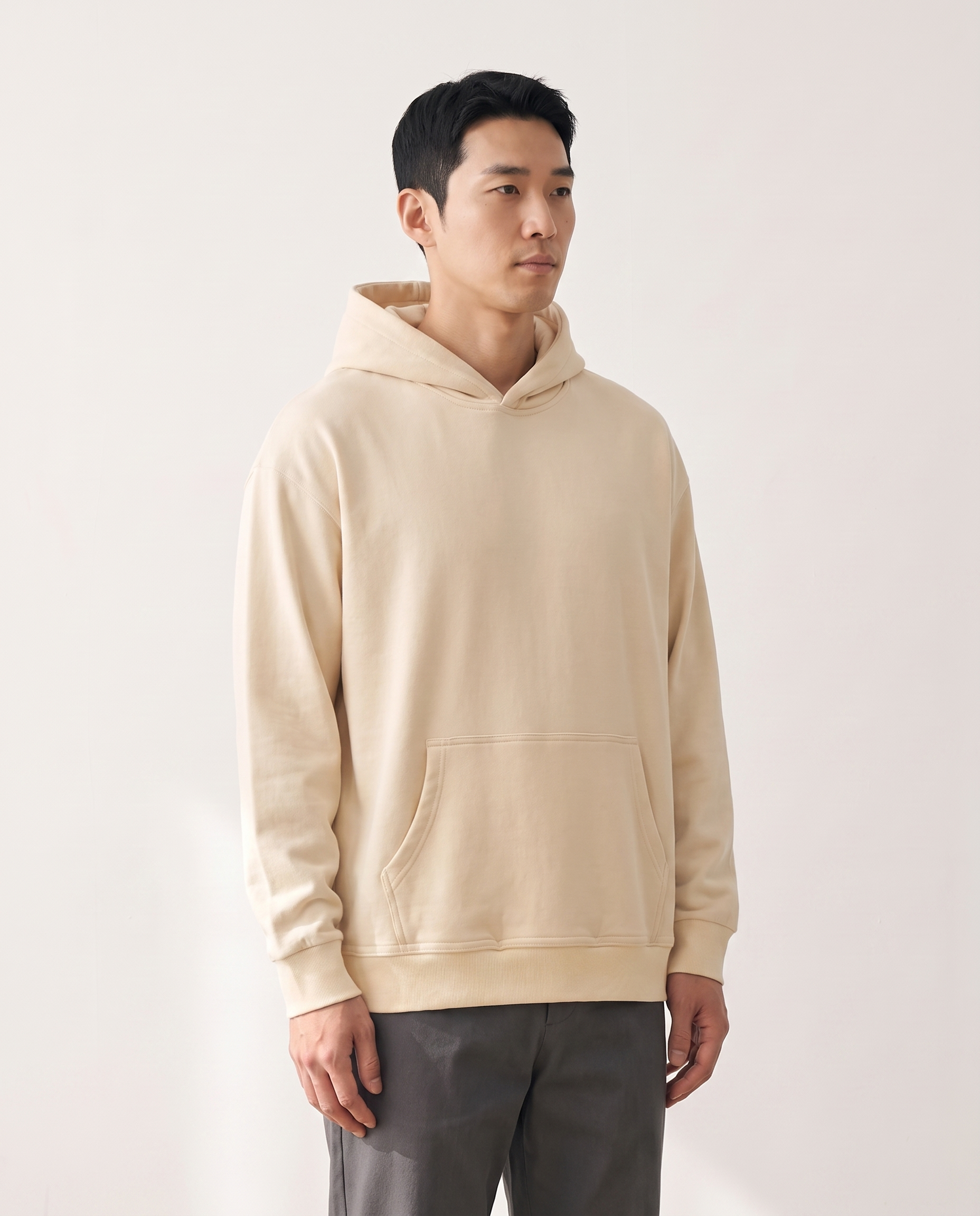 The Heavy Hoodie in apricot, side view