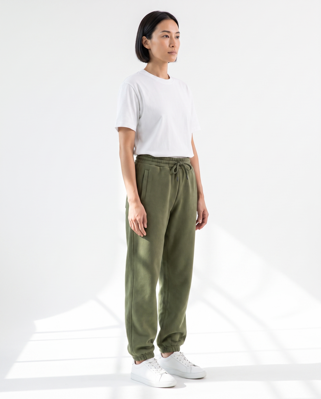 The Heavy Sweatpant in olive, side view