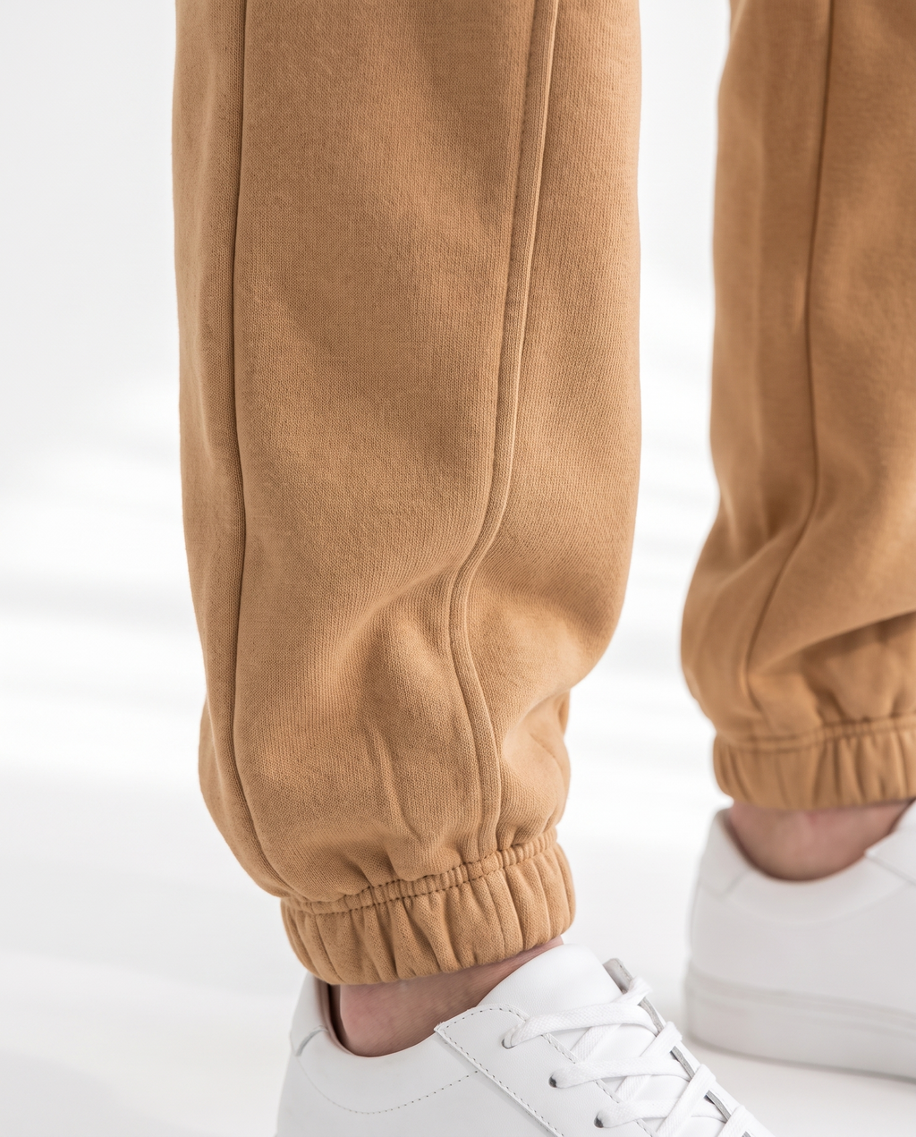 The Heavy Sweatpant in camel, elasticated ankle cuff and leg seams detail