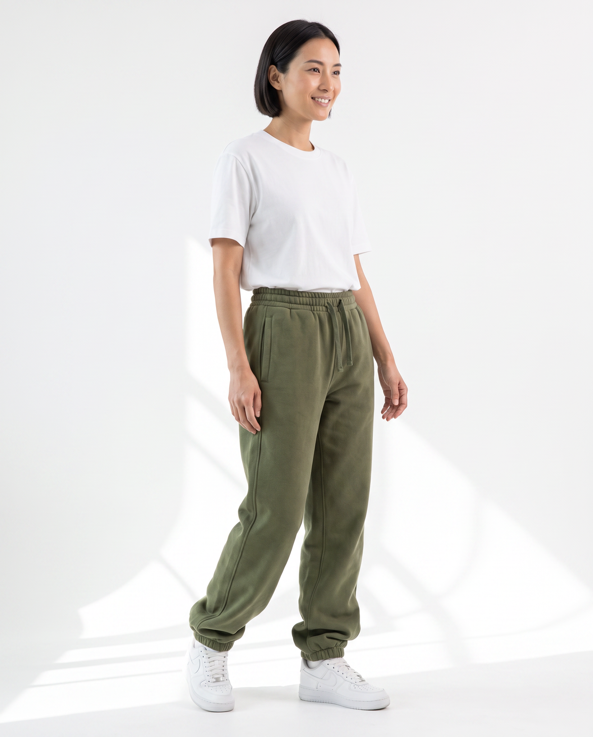The Heavy Sweatpant in olive, side view