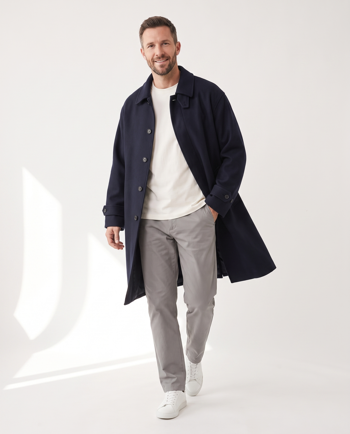 color::Navy|The Coat in navy, worn open, on model