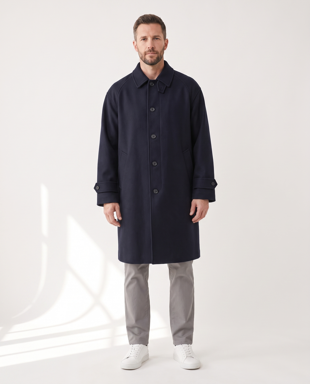 The Coat in navy, buttoned, full silhouette
