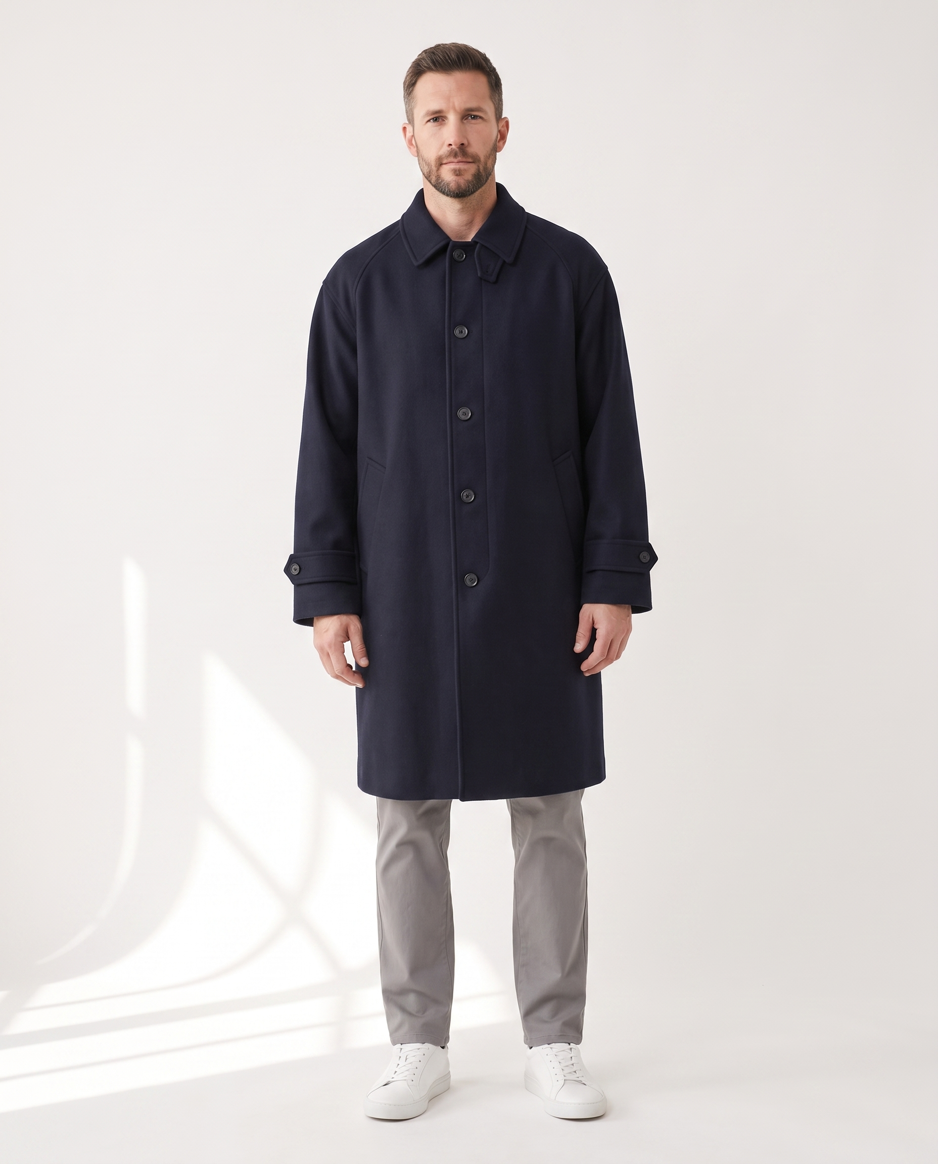 The Coat in navy, buttoned, full silhouette