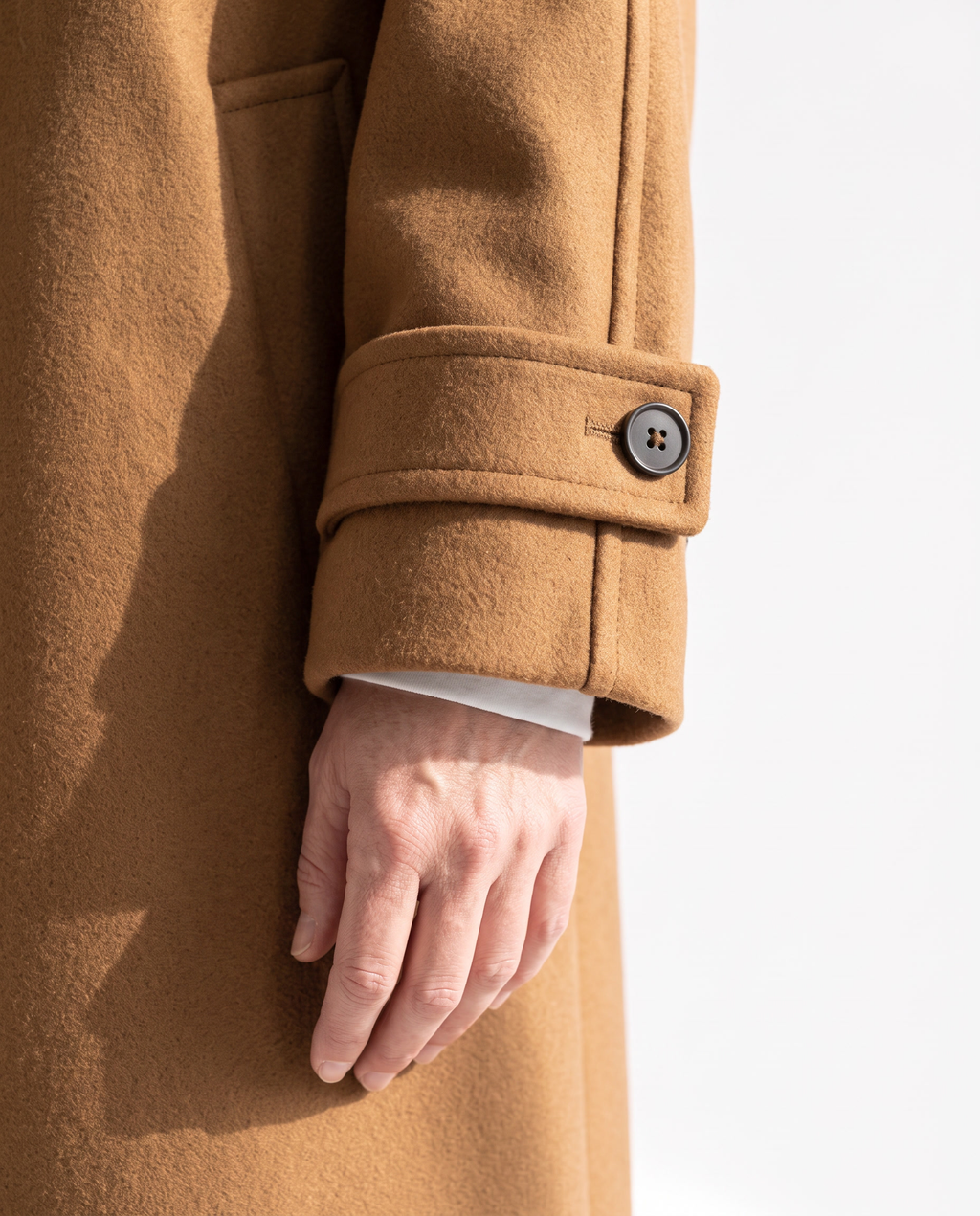 The Coat, shirt-style sleeve placket tab and cuff button detail